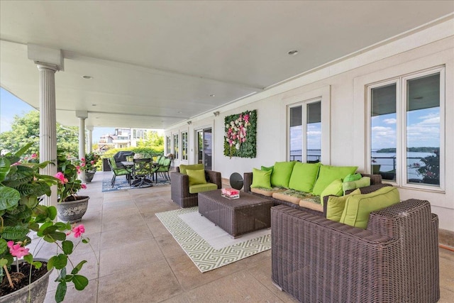 view of patio / terrace featuring outdoor dining space and an outdoor living space