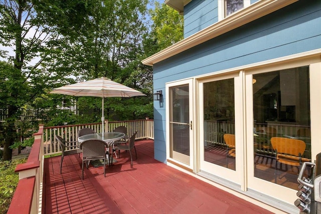 wooden deck with outdoor dining area