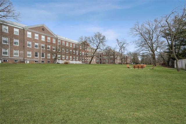 view of property's community with a yard