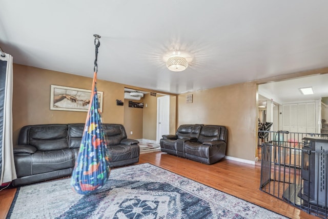 living room featuring baseboards and wood finished floors