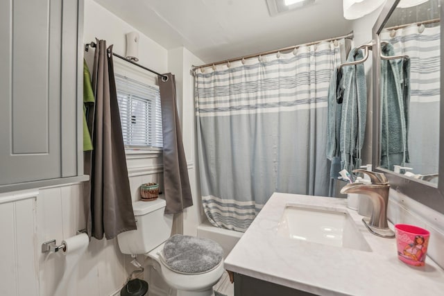 bathroom with toilet, visible vents, shower / tub combo with curtain, and vanity