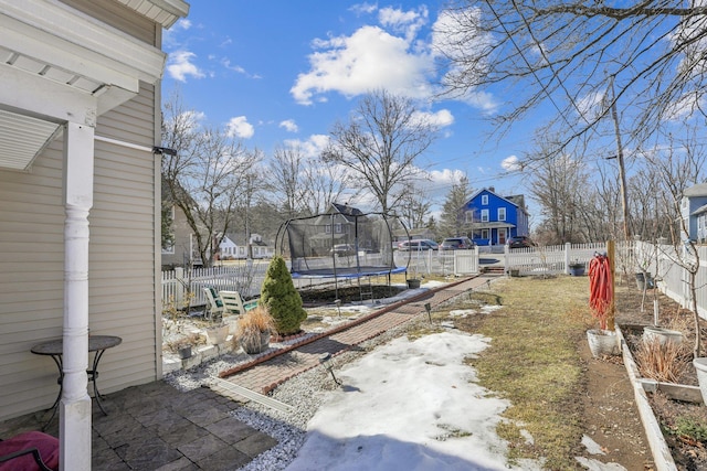 view of yard with a fenced backyard and a trampoline