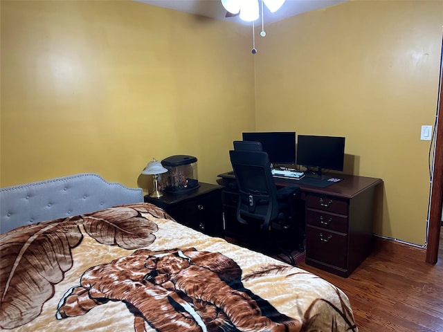 bedroom with wood finished floors