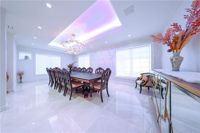 dining area featuring a chandelier, recessed lighting, baseboards, a raised ceiling, and crown molding