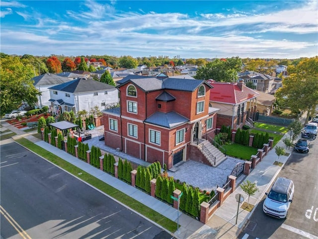 birds eye view of property with a residential view