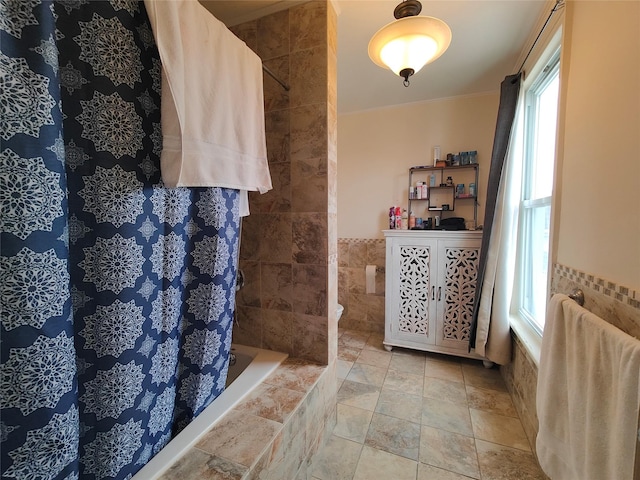 324 150th St, Whitestone, NY 11357 - full bathroom with tile walls, tiled shower / bath, and ornamental molding
