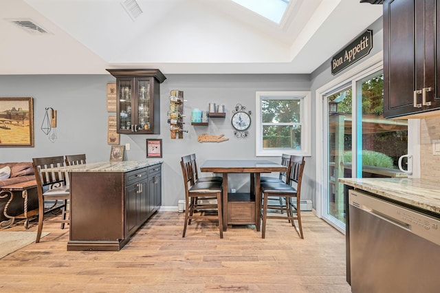 kitchen featuring stainless steel dishwasher, light wood-type flooring, visible vents, and dark brown cabinetry