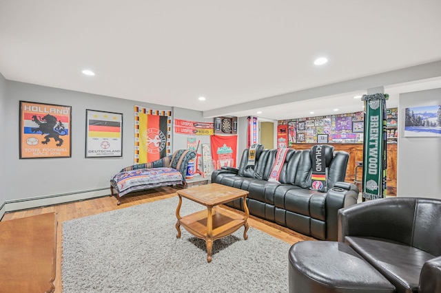 living room with baseboard heating, wood finished floors, and recessed lighting