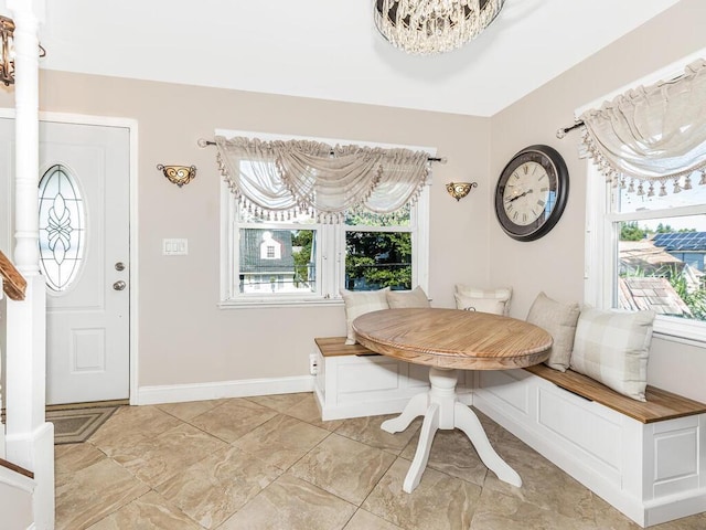 16 Joan Dr, Yonkers, NY 10704 - dining room with breakfast area, a chandelier, and baseboards