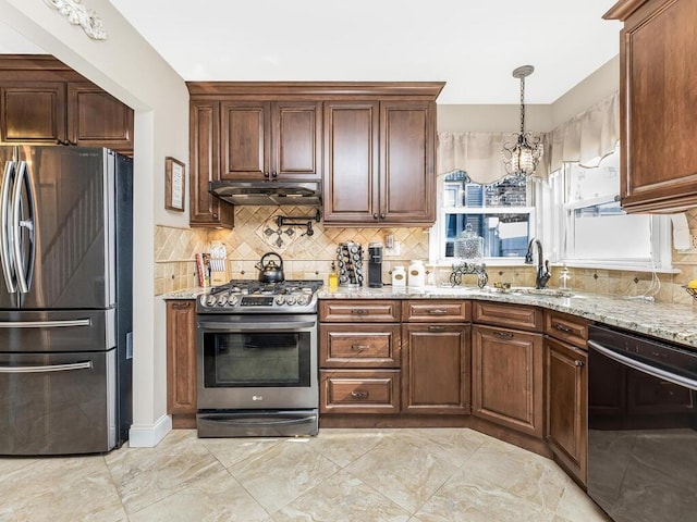 16 Joan Dr, Yonkers, NY 10704 - kitchen with stainless steel appliances, under cabinet range hood, decorative backsplash, and light stone countertops