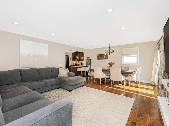 16 Joan Dr, Yonkers, NY 10704 - living area with a chandelier, dark wood-style flooring, and recessed lighting