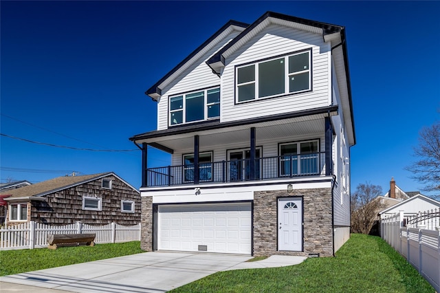 view of front of house featuring an attached garage, a balcony, fence, driveway, and a front yard