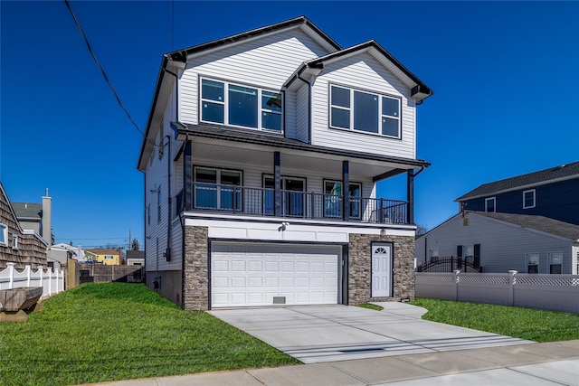 view of front facade with a garage, a front yard, concrete driveway, and fence