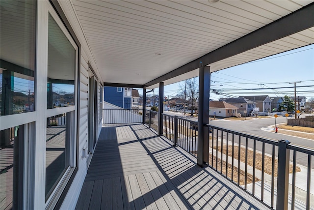 wooden terrace featuring a residential view