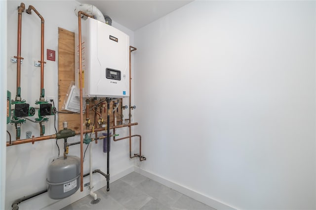 utility room with tankless water heater