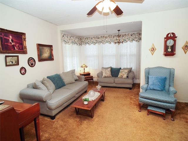 carpeted living area with a ceiling fan