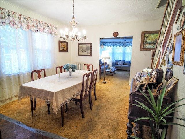 carpeted dining space featuring a healthy amount of sunlight, an inviting chandelier, stairway, and crown molding