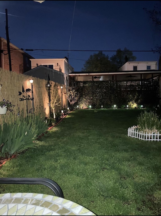 yard at twilight with fence