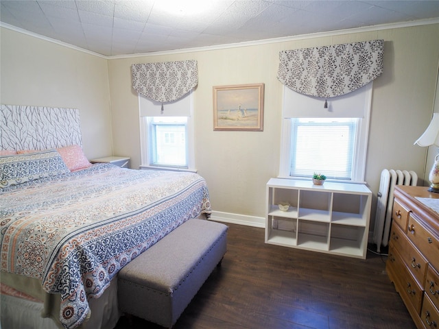 bedroom with baseboards, ornamental molding, radiator, and dark wood-type flooring