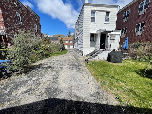 5844 78th Ave, Glendale, NY 11385 - back of property with a yard