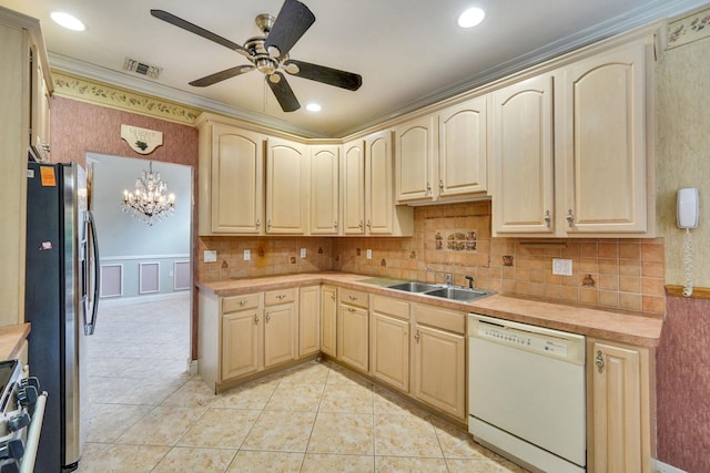 kitchen featuring light tile patterned flooring, stainless steel appliances, a sink, visible vents, and light countertops