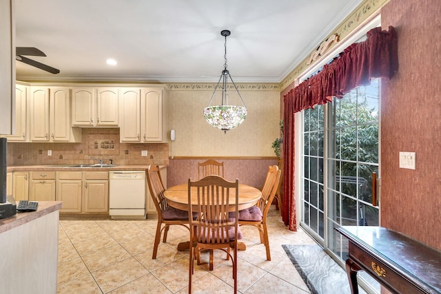 dining area with light tile patterned floors, ornamental molding, and a ceiling fan