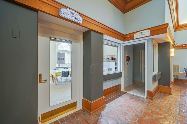 foyer entrance with tile patterned floors and baseboards