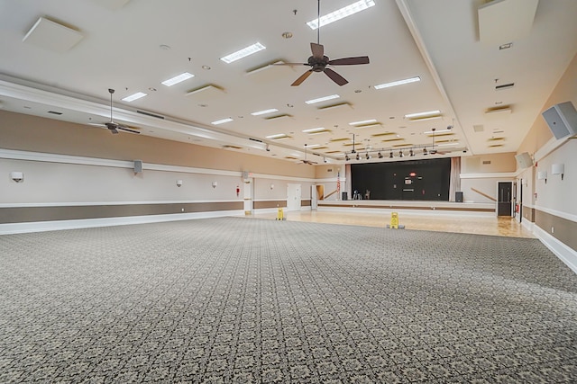 garage with ceiling fan and baseboards