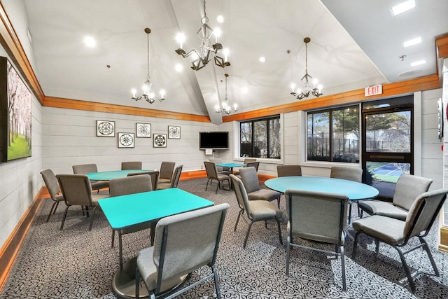 rec room featuring an inviting chandelier and vaulted ceiling