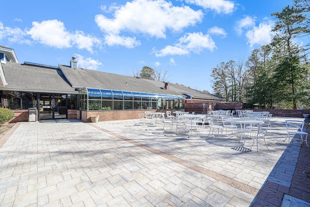 exterior space featuring a sunroom