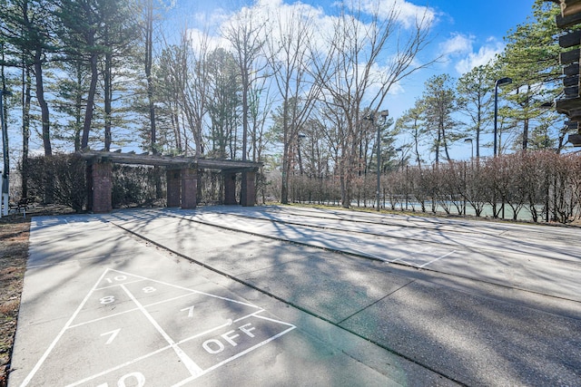 view of home's community featuring shuffleboard