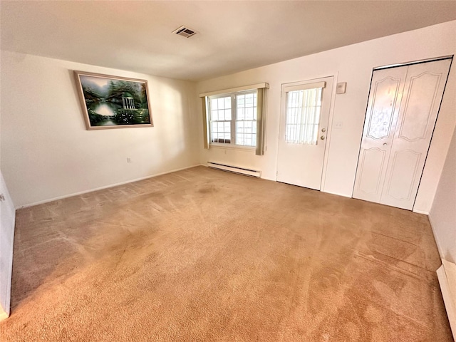 interior space with a baseboard radiator and visible vents