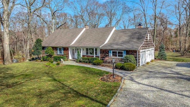 view of front of home featuring a garage, covered porch, driveway, a chimney, and a front yard