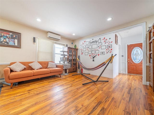 living room featuring hardwood / wood-style floors, a wall mounted AC, and recessed lighting