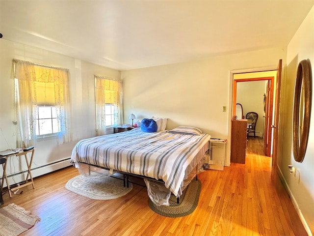 2838 Old Kings Rd, Catskill, NY 12414 - bedroom with light wood finished floors and a baseboard radiator
