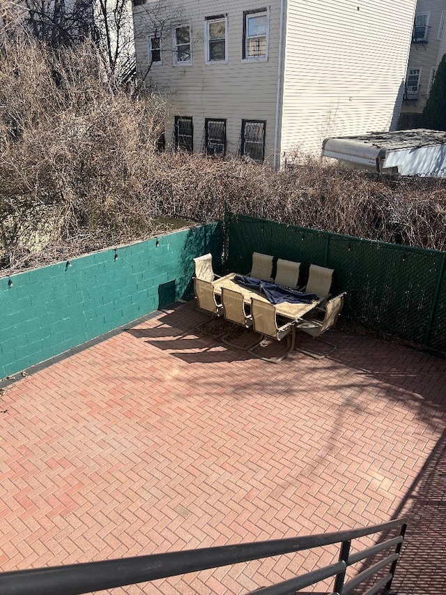 view of patio / terrace featuring fence