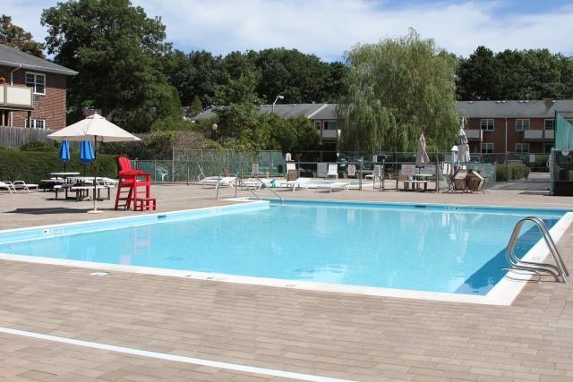 view of pool with a patio and fence