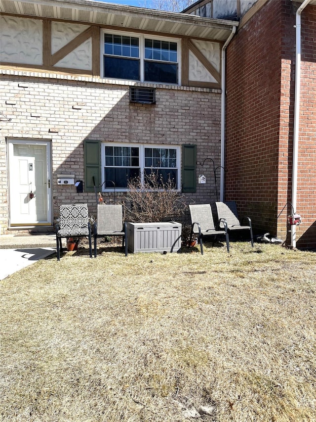 exterior space featuring brick siding