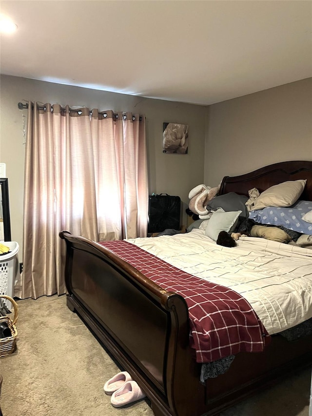 bedroom with light colored carpet