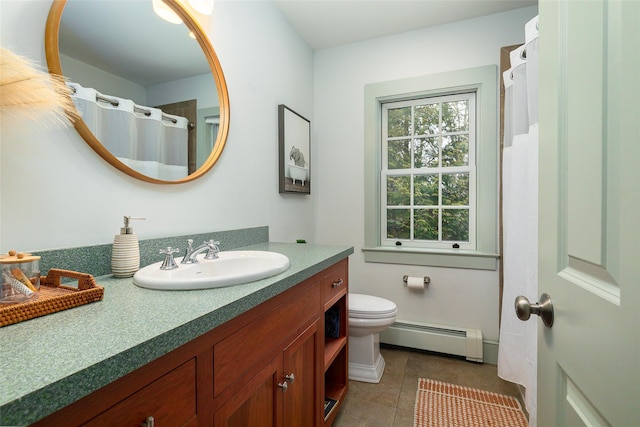 full bath with toilet, a baseboard radiator, tile patterned flooring, and vanity