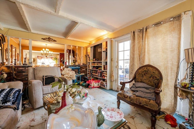 carpeted living area featuring a notable chandelier