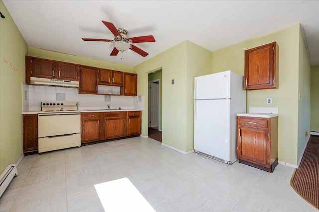 kitchen featuring white appliances, a ceiling fan, light countertops, under cabinet range hood, and a baseboard heating unit