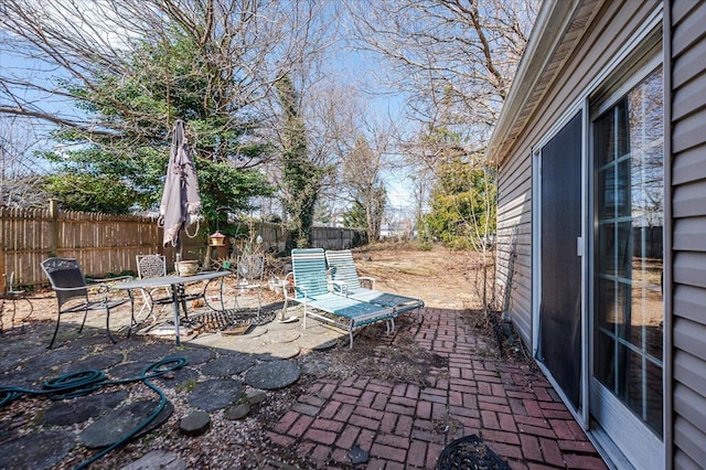 view of patio / terrace featuring outdoor dining area and a fenced backyard