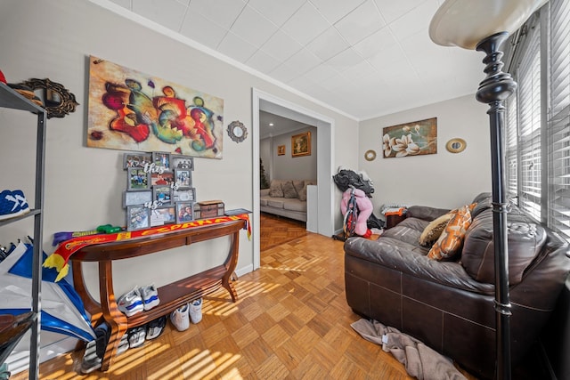 living room featuring crown molding