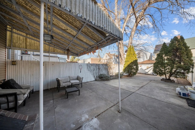 view of patio featuring fence