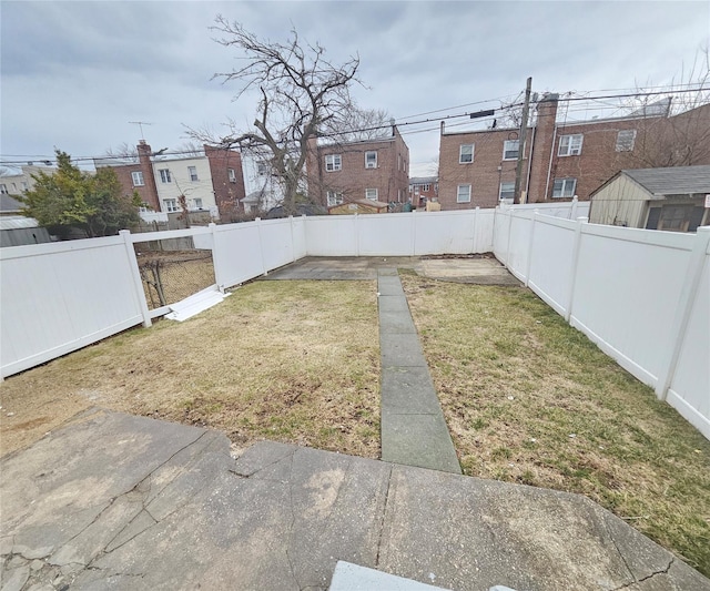 view of yard with a fenced backyard