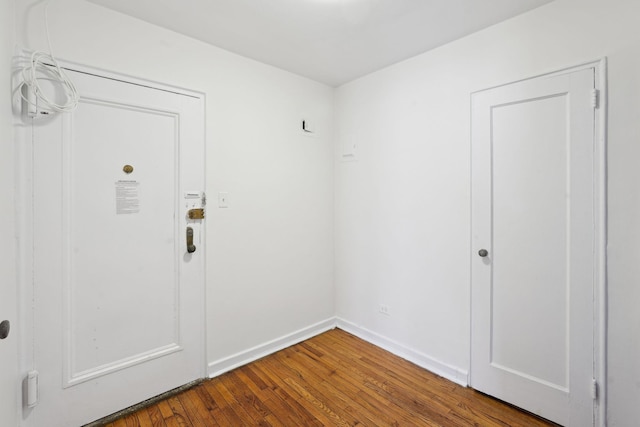 interior space featuring hardwood / wood-style flooring and baseboards