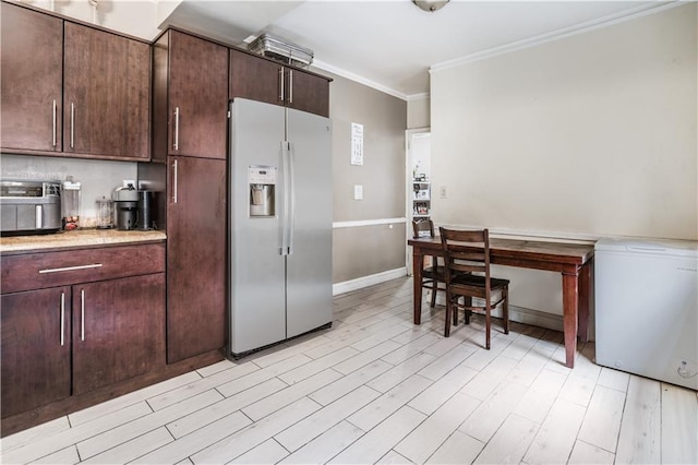 kitchen with light wood-style flooring, refrigerator, dark brown cabinetry, stainless steel fridge with ice dispenser, and crown molding