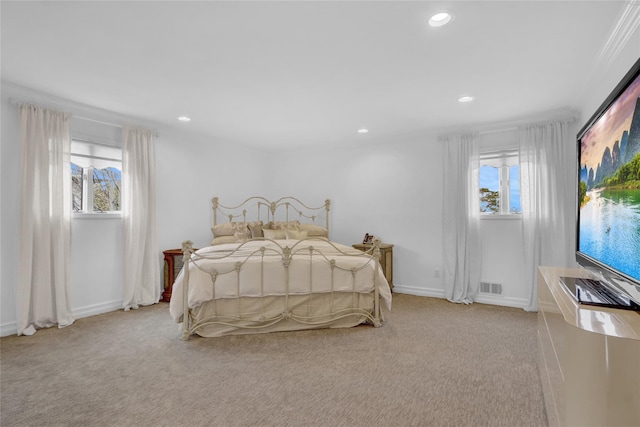 carpeted bedroom with recessed lighting, visible vents, baseboards, and multiple windows