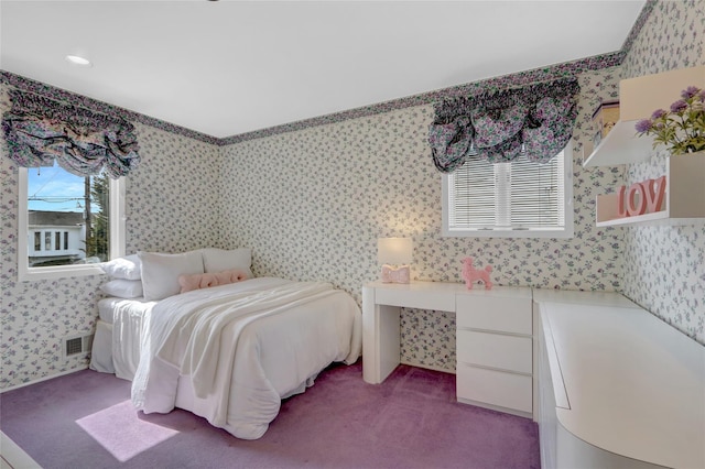 bedroom featuring carpet floors, visible vents, and wallpapered walls